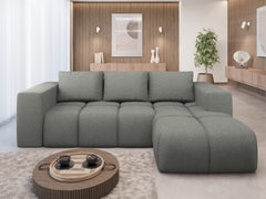 FLAVIO Corner Sofa Bed in modern living room setup.