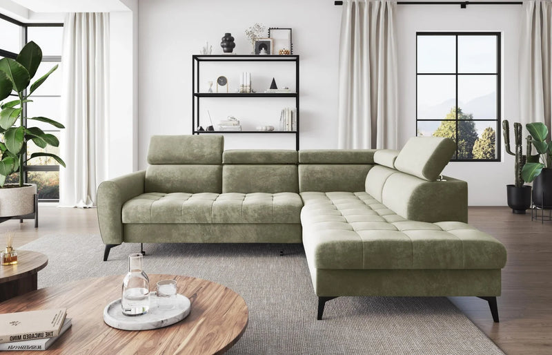 BJORN L Corner Sofa Bed in modern living room, green velour fabric, adjustable headrests.