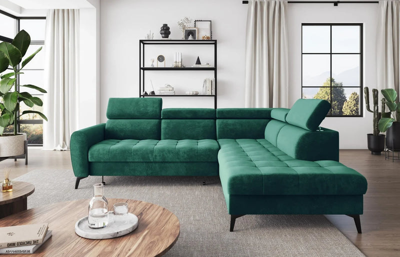 BJORN L Corner Sofa Bed in green velour fabric with adjustable headrests in a modern living room setting.