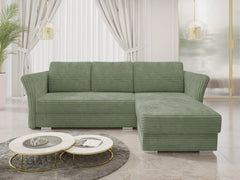 Luxurious green corner sofa bed in a modern living room with plush corduroy fabric.