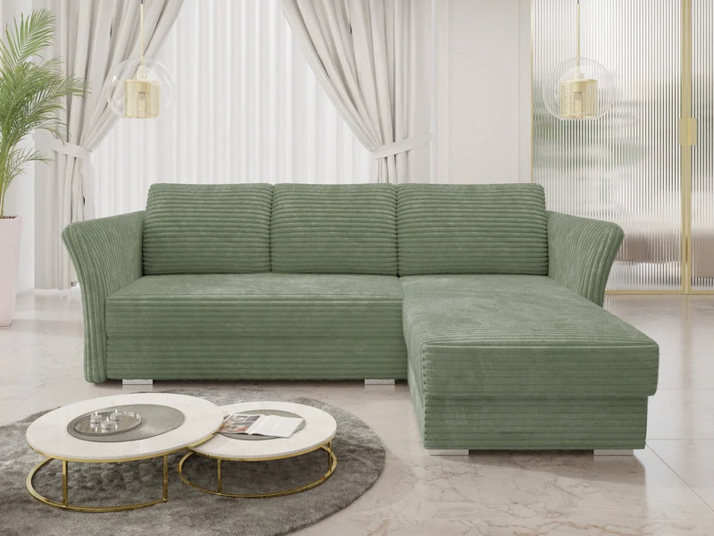Luxurious green corner sofa bed in a modern living room with plush corduroy fabric.