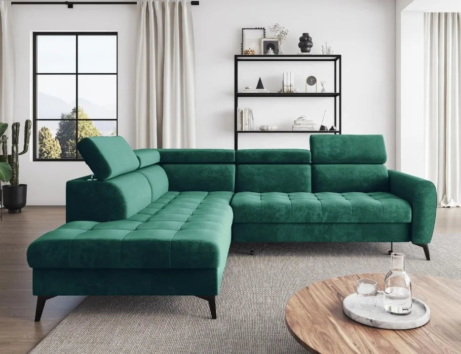 Modern green BJORN L corner sofa bed in living room with adjustable headrests and high metal legs.
