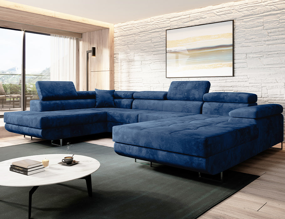 Luxurious blue VARBERG Corner Sofa U-shape with velvet upholstery and fold-out design in a stylish living room.