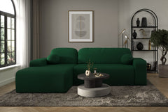 Tori Corner Sofa with dark green Cloud fabric upholstery, decorative cushions, and modern design in a stylish living room setting