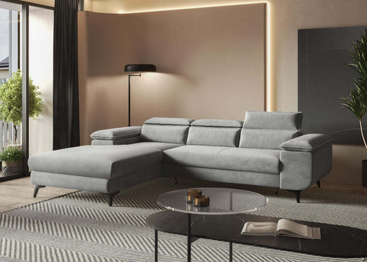 Corner sofa bed with adjustable headrests in a modern living room setting.