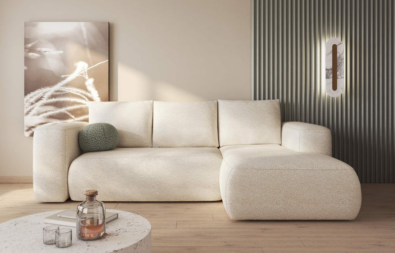 LAMBI corner sofa bed with multicoloured upholstery in a modern living room setting.